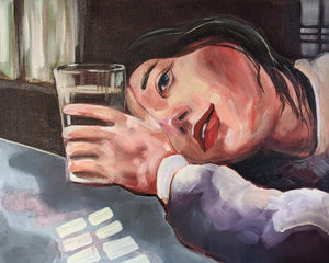 Young woman staring listlessly into the distance holding a glass of water.